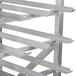 A Winholt aluminum can rack with many metal shelves.