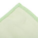 A close up of a green Unger Microfiber Glass Cleaning Cloth with a white border.