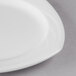 A close up of a Libbey Royal Rideau white porcelain plate with a small rim.