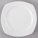 A Libbey Royal Rideau white porcelain plate on a gray surface.