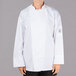 A person wearing a white Chef Revival long sleeve chef jacket with a mesh back.