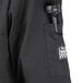 A black Chef Revival short sleeve chef coat with a black object in the back pocket.