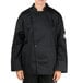 A person wearing a black Chef Revival long sleeve chef jacket with mesh back.