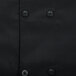 A close up of the buttons on a black Chef Revival chef jacket.