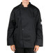 A person wearing a black Chef Revival long sleeve chef coat with a mesh back.