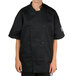 A person wearing a black Chef Revival chef coat.
