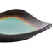 A Libbey stoneware dip dish with a black and green square design with a brown rim.