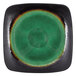 A green and black square stoneware plate with round brown detailing.