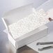 8 3/4" x 3 5/8" 3-Ply Glassine 2 lb. White Candy Box Pad with Gold Floral Pattern   - 250/Case Main Thumbnail 1