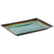 A Libbey rectangular stoneware platter with a blue surface and a green and yellow rim.
