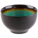 A black stoneware bowl with a green rim.
