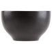 A close-up of a black Libbey stoneware bowl with white lines.