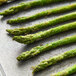 A close up of asparagus spears on a pan.