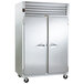 A Traulsen hot food holding cabinet with two white doors.