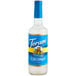 A Torani Sugar-Free Coconut flavoring syrup 750 mL glass bottle with a blue label.