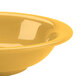 A close up of a yellow Thunder Group melamine soup bowl.