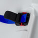 A blue seat belt on a white plastic baby changing station.