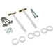 A group of silver metal screws, bolts, and hardware for a Continental Vertical Baby Changing Station.