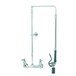 A T&S chrome wall mounted pre-rinse faucet with a hose and low flow spray valve.