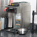 A Bunn commercial automatic coffee machine on a counter.