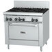 A large stainless steel Garland gas range with black knobs.