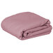 A folded pink Intedge rectangular table cover.