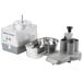 A Robot Coupe CL40 food processor with a silver container and curved edge.
