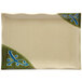 A white rectangular plate with a green and blue wavy edge design.