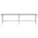 A long stainless steel Advance Tabco work table with an open base.
