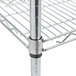 A Metro stainless steel wire shelf with metal rods on a counter.