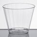 A WNA Comet Classicware clear plastic fluted tumbler on a white surface.