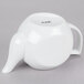 A white CAC porcelain teapot with a handle.