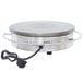 A Waring round stainless steel electric crepe maker on a table.