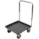A black Vollrath Traex rack dolly with metal handles and wheels.