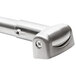 A stainless steel curved shower curtain rod with a metal handle.