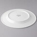 A white Reserve by Libbey porcelain plate with a circular design on it.