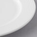 A close up of a Libbey Aluma White Porcelain Plate with a thin rim.