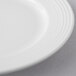 A close-up of a Libbey Aluma White Porcelain Plate with a thin rim.