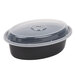 A black plastic Pactiv Newspring VERSAtainer oval container with a clear lid.