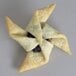 A pastry with a star shape on top made with an Ateco polystyrene pinwheel cookie cutter.