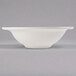 A white Libbey porcelain grapefruit bowl with a rim on a gray background.