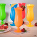 GET HUR-1-OR Cheers 15 oz. Orange Plastic Hurricane Glass - 24/Case Main Thumbnail 1