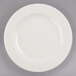 A Libbey ivory porcelain plate with a white rim on a white background.