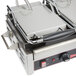 A Cecilware double panini sandwich grill on a counter with a double-sided grill plate.