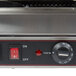 A Cecilware double panini sandwich grill with grooved surfaces on a counter in a professional kitchen.