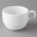 A white Reserve by Libbey porcelain cup with a handle on a gray surface.