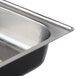 A close-up of a Sterno chalkboard chafer lid on a metal tray.