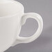 A white Libbey porcelain coffee cup with a handle.