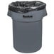 A Continental Huskee grey round trash can with a black plastic liner.