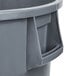 A gray Continental Huskee round trash can with a handle.
